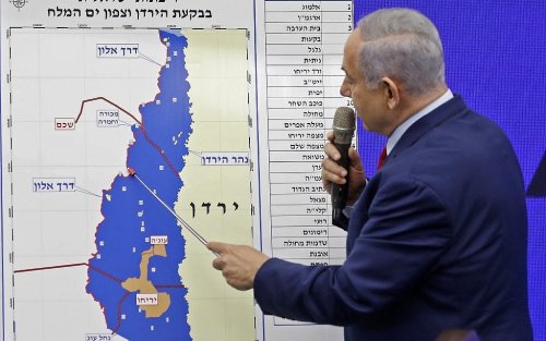 Photo: Israeli Prime Minister Benjamin Netanyahu points at a map of the Jordan Valley as he gives a statement in Ramat Gan, near the Israeli coastal city of Tel Aviv, on September 10, 2019
(Photo: MENAHEM KAHANA/AFP via Getty Images)